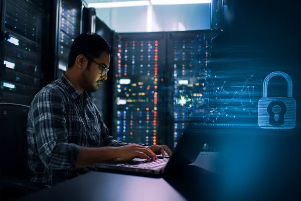 A woman smiling while playing online games on her laptop, surrounded by neon casino elements, showcasing TKPK’s diverse game collection.